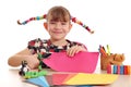 Happy little girl cutting paper