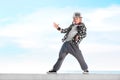 Happy little girl dancing hip-hop on blue sky background Royalty Free Stock Photo