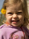 Happy little girl with dandelion