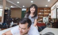 Happy little girl daughter playing with father while ride dad back and dad lying on the bed at home. Royalty Free Stock Photo