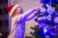Happy little girl decorate Christmas tree Royalty Free Stock Photo