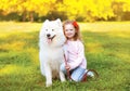 Happy little girl and dog having fun Royalty Free Stock Photo