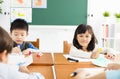 Little girl drawing in the classroom Royalty Free Stock Photo