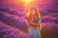 Happy little girl with dress enjoying lavender field with bouquet of flowers Royalty Free Stock Photo