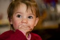 Happy little girl eating chocolate Royalty Free Stock Photo