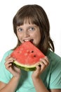 Happy little girl eating melon