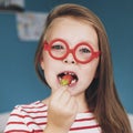 Happy little girl eating strawberries at home Royalty Free Stock Photo