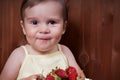 Happy little girl eating strawberries Royalty Free Stock Photo