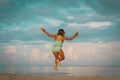 Happy little girl enjoy beach, child jump on sea vacation