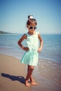 Happy little girl enjoying sunny day at the beach. Nice look Royalty Free Stock Photo