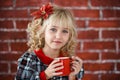 Child with red cup of hot cocoa or chocolate with marshmallow Royalty Free Stock Photo