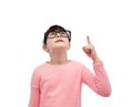 Happy little girl in eyeglasses pointing finger up Royalty Free Stock Photo