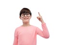 Happy little girl in eyeglasses pointing finger up Royalty Free Stock Photo