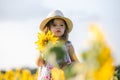 Happy little girl on the field of sunflowers in summer. beautiful little girl in sunflowers Royalty Free Stock Photo