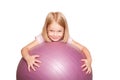 Happy little girl with fitness ball. Royalty Free Stock Photo