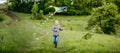 Happy little girl flying bright kite Royalty Free Stock Photo