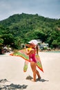 Happy little girl with flying kite on tropical beach Royalty Free Stock Photo