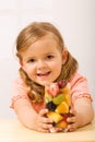 Happy little girl with fruity refreshment Royalty Free Stock Photo