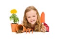 Happy little girl with gardening utensils Royalty Free Stock Photo