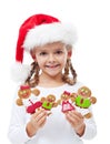 Happy little girl with gingerbread people family