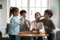 Happy little girl giving high five to preschool brother. Royalty Free Stock Photo