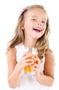 Happy little girl with glass of juice isolated Royalty Free Stock Photo