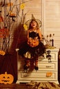 Happy little girl with halloween pumpkin. Wicked little witch. Girl happy smiling on halloween. Prettiest pumpkin in the