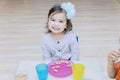 Happy little girl having breakfast with her friend Royalty Free Stock Photo