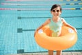 Happy little girl having fun in swimming pool Royalty Free Stock Photo