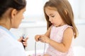 Happy little girl at health exam at doctor office. Medicine and health care concept Royalty Free Stock Photo