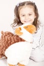 Happy little girl with her sheep toy - celebrating Eid ul Adha -