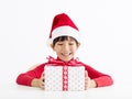 Happy little girl holding Christmas gift Royalty Free Stock Photo