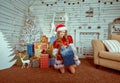 Happy little girl holding Christmas gift box Royalty Free Stock Photo