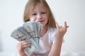 Happy little girl holding dollar bills closeup Royalty Free Stock Photo