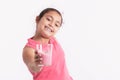 Happy little girl holding a strawberry juice glass Royalty Free Stock Photo