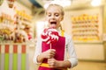 Happy little girl holds fresh lollipop Royalty Free Stock Photo