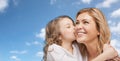 Happy little girl hugging and kissing her mother Royalty Free Stock Photo