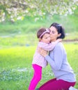 Happy little girl hugging and kissing her mother Royalty Free Stock Photo