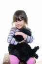 Happy little girl hugging lovely kitten. Royalty Free Stock Photo