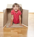 Happy little girl inside a paper box Royalty Free Stock Photo