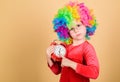 Happy little girl. International childrens day. Child care. Happy moments. Kid hold alarm clock. Stop being so serious Royalty Free Stock Photo