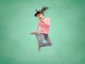 Happy little girl jumping in air over school board Royalty Free Stock Photo