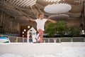 Happy little girl playing white plastic balls pool in amusement park. playground for kids Royalty Free Stock Photo