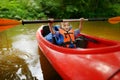 Happy little girl on a kayak on a river Royalty Free Stock Photo