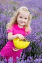 Happy little girl is in a lavender field