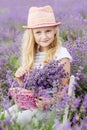 Happy little girl is in a lavender field Royalty Free Stock Photo