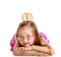 Happy little girl laying on floor isolated Royalty Free Stock Photo