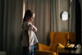 Happy little girl learning dance moves watching online video lessons on phone at home. Royalty Free Stock Photo