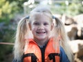 Happy little girl in a lifejacket Royalty Free Stock Photo
