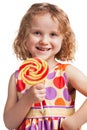 Happy little girl with a lollipop